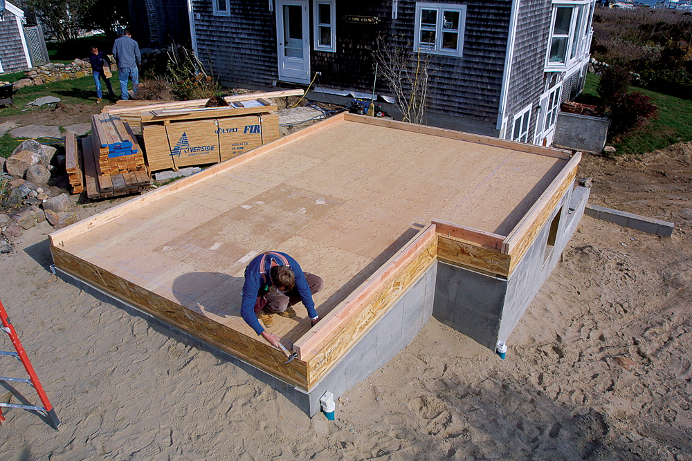 When wall positions are laid out, cut all the top and bottom plates (the long horizontal members) for the exterior walls, and place them on their layout lines.