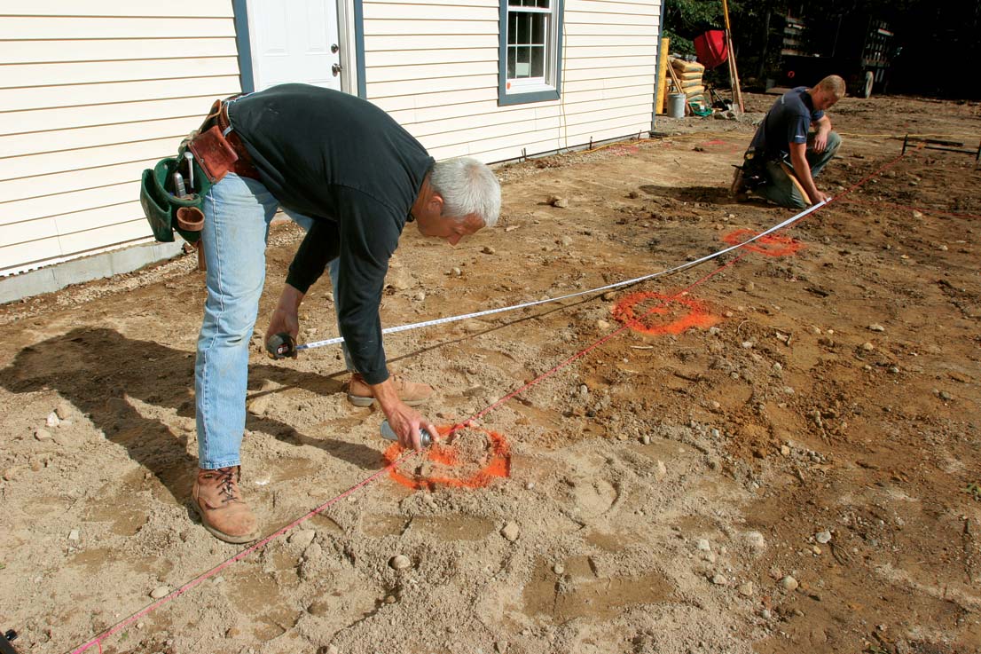 Marking piers with paint.