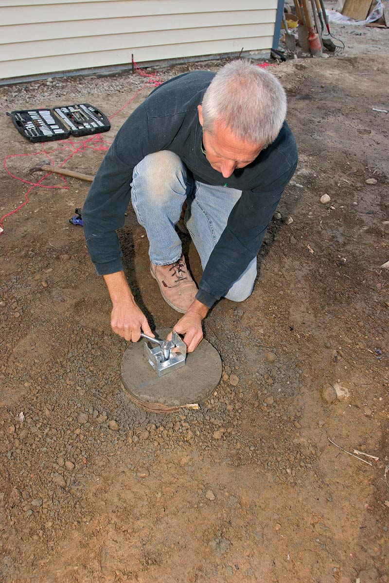 Attaching adjustable post bases.