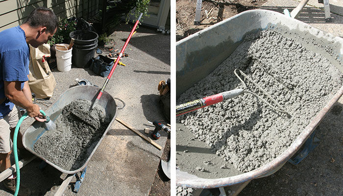 adding small amounts of water into mixture in wheelbarrow