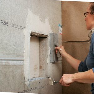 cover each joint in the shower with mesh tape and a coat of thinset