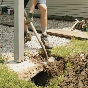 I dug around a couple of footings and found that they didn’t extend below the frost line.