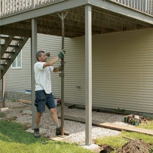 Add temporary support. Before excavating the footings, brace the deck with temporary support columns. Set the columns plumb, and tack them in at the top with staging nails or structural screws.