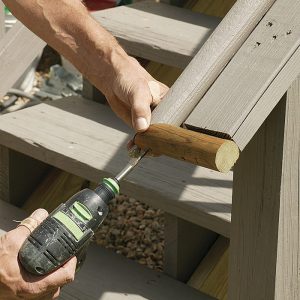 Return for safety. The author trimmed the extralong handrail and guardrail, then mitered the handrail to make a safety return. He glued and screwed the top and bottom returns to the rail to wrap around the end of the guardrail.