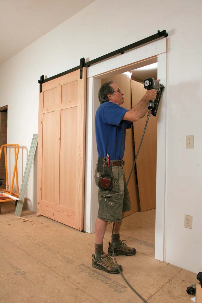 Finish up with casing. Barn-style doors are cased like conventional swinging doors.