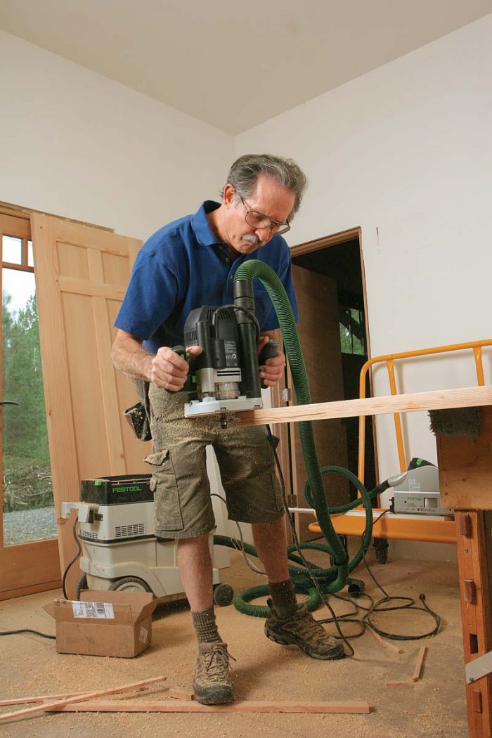 The guide aligns with a groove made with a slot cutter in the door bottom.