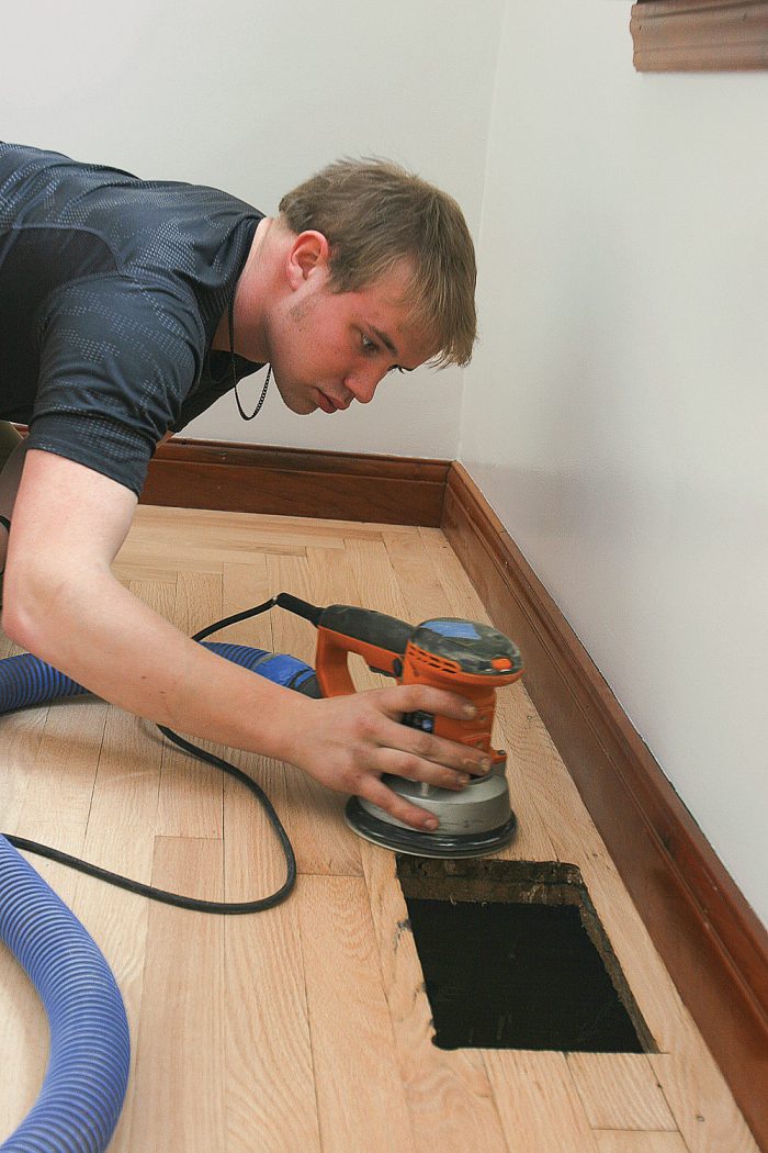 using a random-orbit sander to retouch edges of room