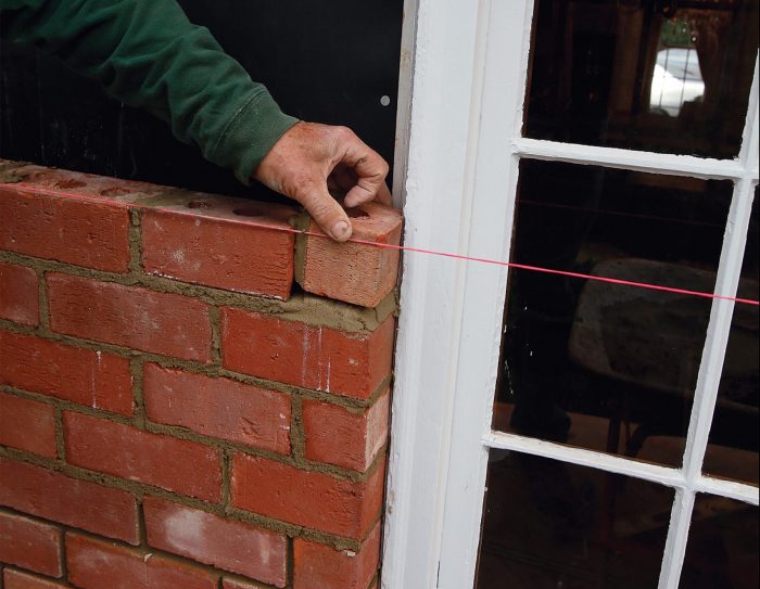 placing a small brick to end the line