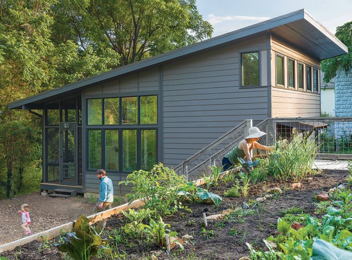 house with family outside in garden