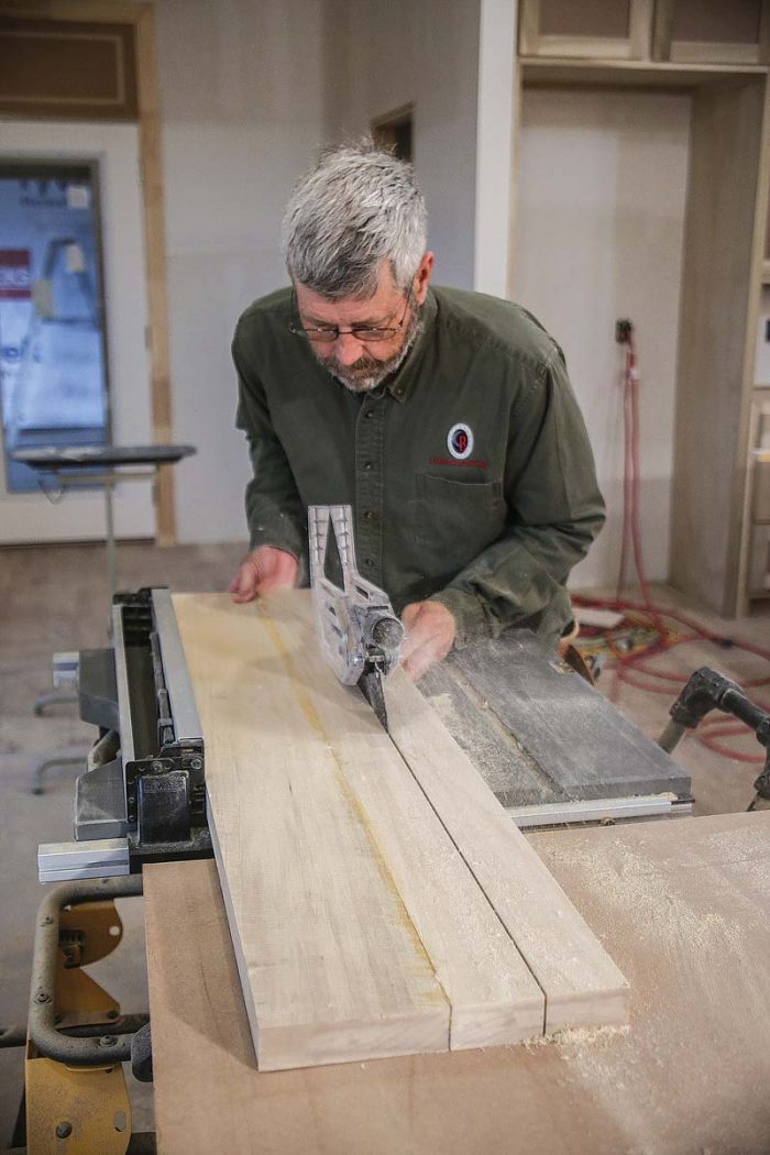 Run the glued-up bottom rail through the tablesaw,