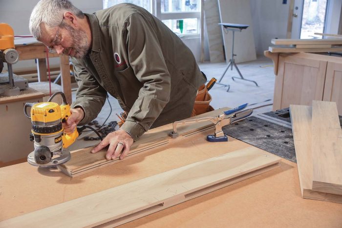 Three passes with the router. The panel grooves are made with a 1⁄4-in. slot-cutting bit in a router.