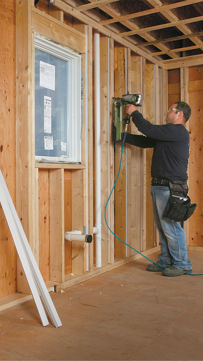 man drilling a wall 