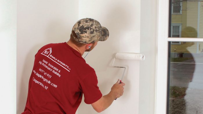 man painting a wall 