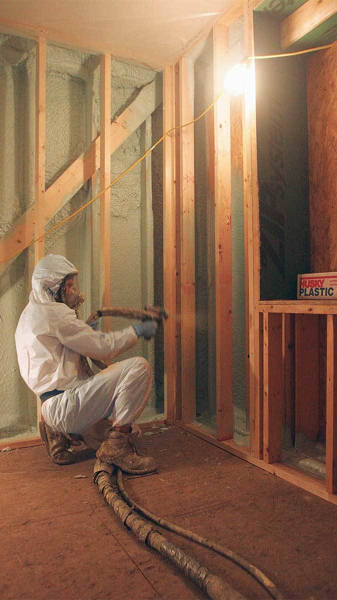 Person installing Insulation Spray