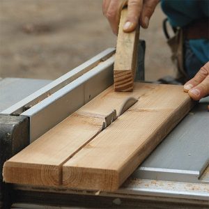 Rip 5/4x6 decking in half. Since the balusters are only 25 in. long, they can be made from scraps and full boards too twisted for decking but fine when cut into short pieces.