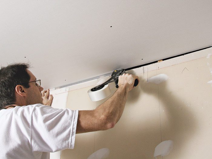 Drywall isn’t always hung perfectly. A problem you sometimes run into when taping inside corners, especially in older homes, is large gaps in the corners between panels. Gaps are typically caused by out-of-square or off-level walls or ceilings or by errors made during measuring. Sometimes a gap can simply be filled with compound, but if it’s wider than 1/2 in. or so, the compound will fall out. The best remedy for this problem is to first put a layer or two of self-adhesive mesh tape into the corner. When you apply the joint compound, the mesh holds it in place. The paper tape can then be positioned in the corner in the normal way. Allow a little extra time for the corner to dry before applying the next coat of compound, because the extra thick layer of joint compound can crack if it is second-coated too soon.