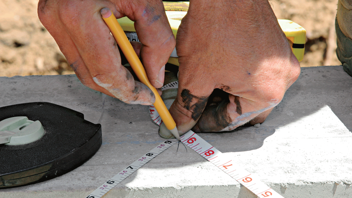 Stretch two tapes from the baseline corners to the middle of the parallel mudsill. The exact middle of the parallel mudsill is where the tapes intersect at the same measurement.