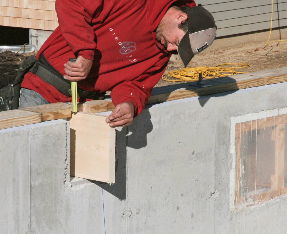 Set a scrap of the beam material in the pocket and measure to the top of the mudsill to determine the thickness of the beam’s support pad.