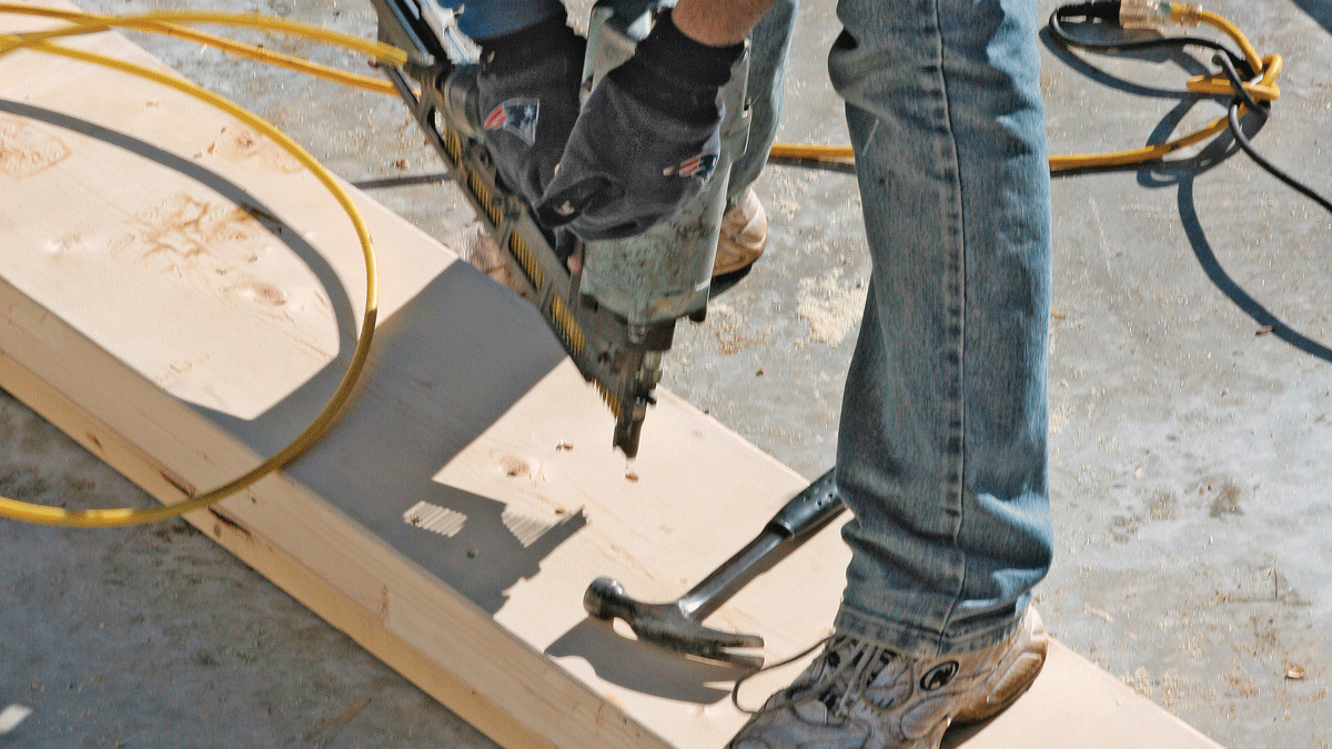 Where a board in the beam bridges a joint in the layer below, drive a row of nails on both sides of the joint (note the joint in the middle layer).