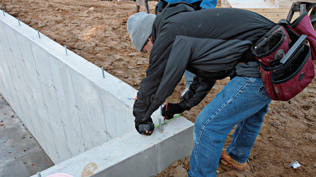 After measuring and marking the width of the mudsill at each end of the foundation (5A), snap a chalkline between the marks (6). All other wall locations spring from this baseline.