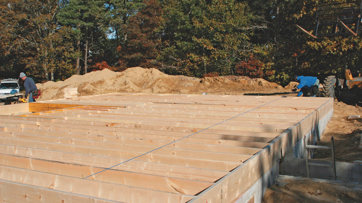 Mark the layout every 4 ft. to identify spacing for the blocking and sheathing. A line snapped at the first mark guides the first course of sheathing.