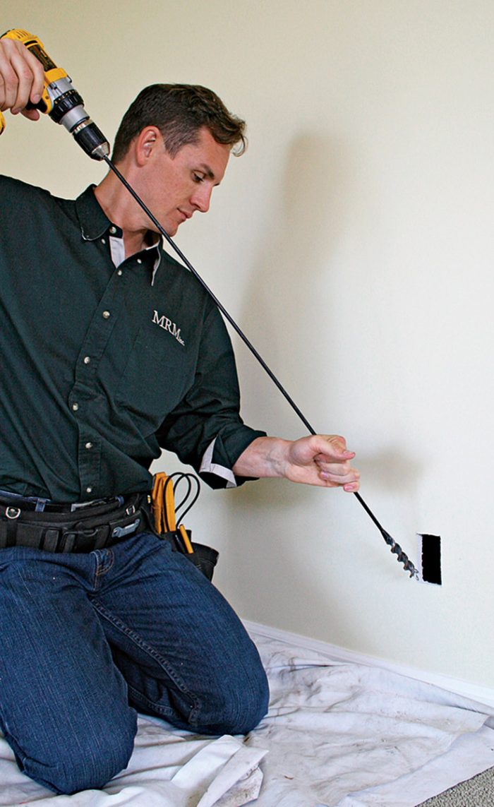 Use a flex bit to drill through wall plates.