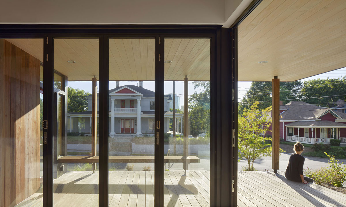 person sitting on covered porch