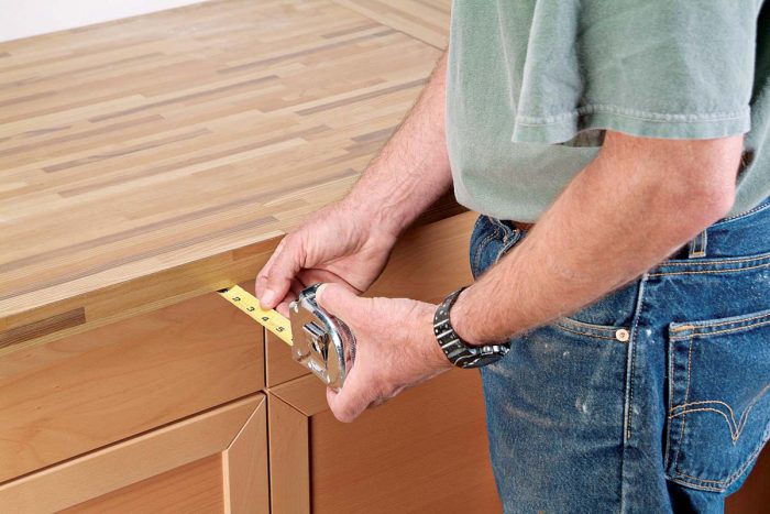 Measure the overhang to the cabinet before cutting of the front lip.