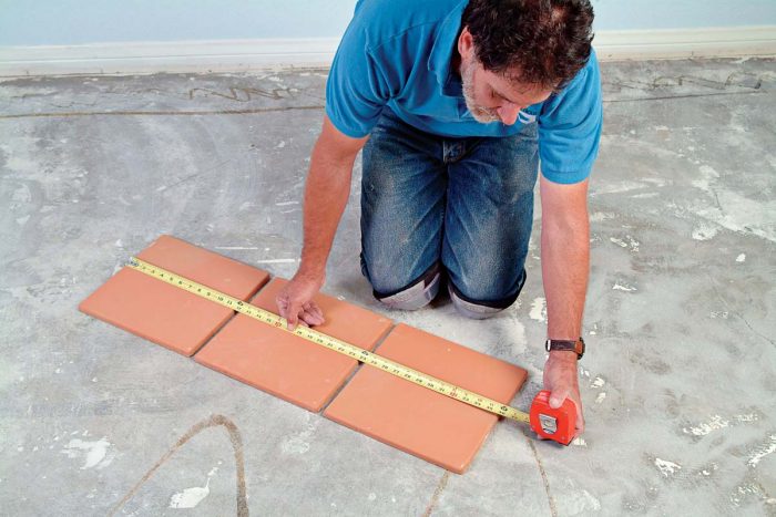 Measure three tiles set in a row. The grid will be the size of the three tiles plus the width of one additional grout joint.