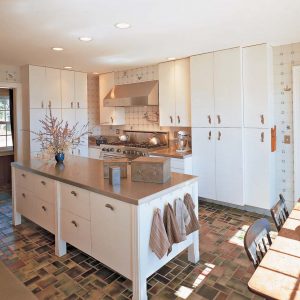 This glazed stoneware tile set in a random pattern adds just the right touch to a country kitchen.