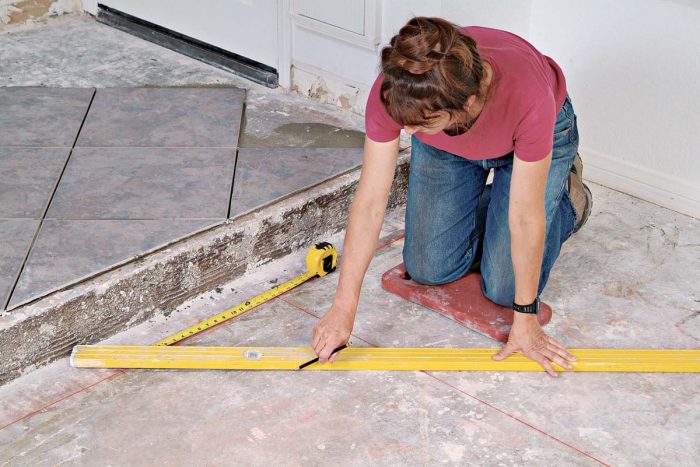 The layout lines keep the rows of tile running at a perfect 45° angle to the step.