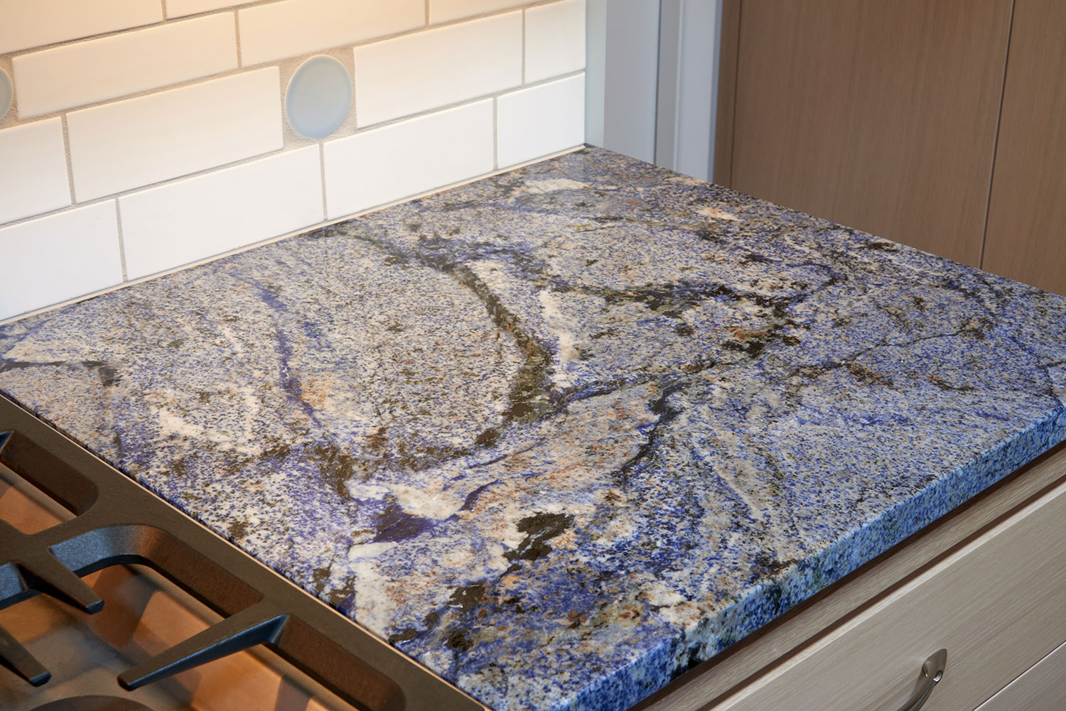 Grey, black, and blue granite countertop