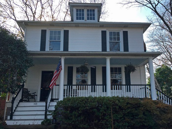 The outside of a two story farmhouse