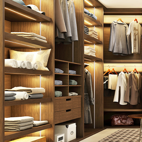 Large walk-in closet illuminated by Vario track lighting