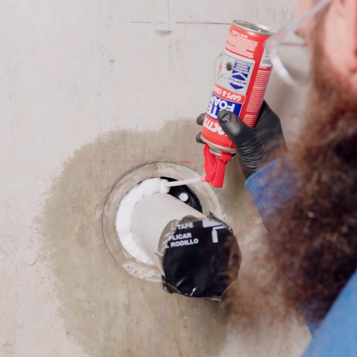 Gasket penetration being filled with TITE FOAM