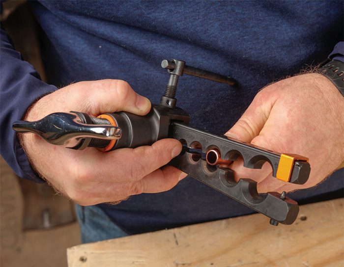 inserting the tubing into the correctly sized hole in the block