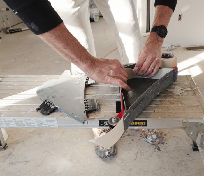 Myrond adding drywall tape to the banjo