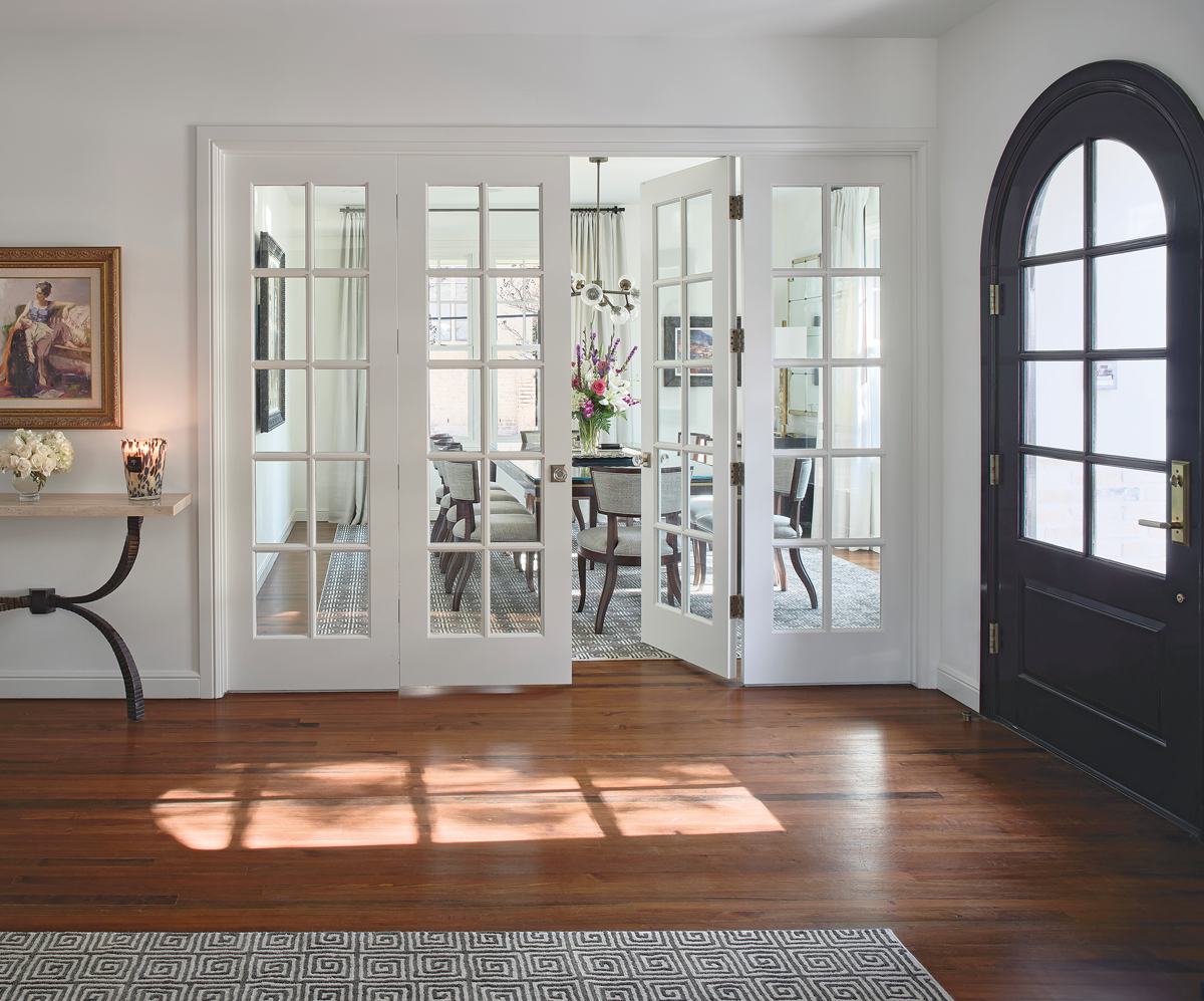 entryway with a blue front door with windows