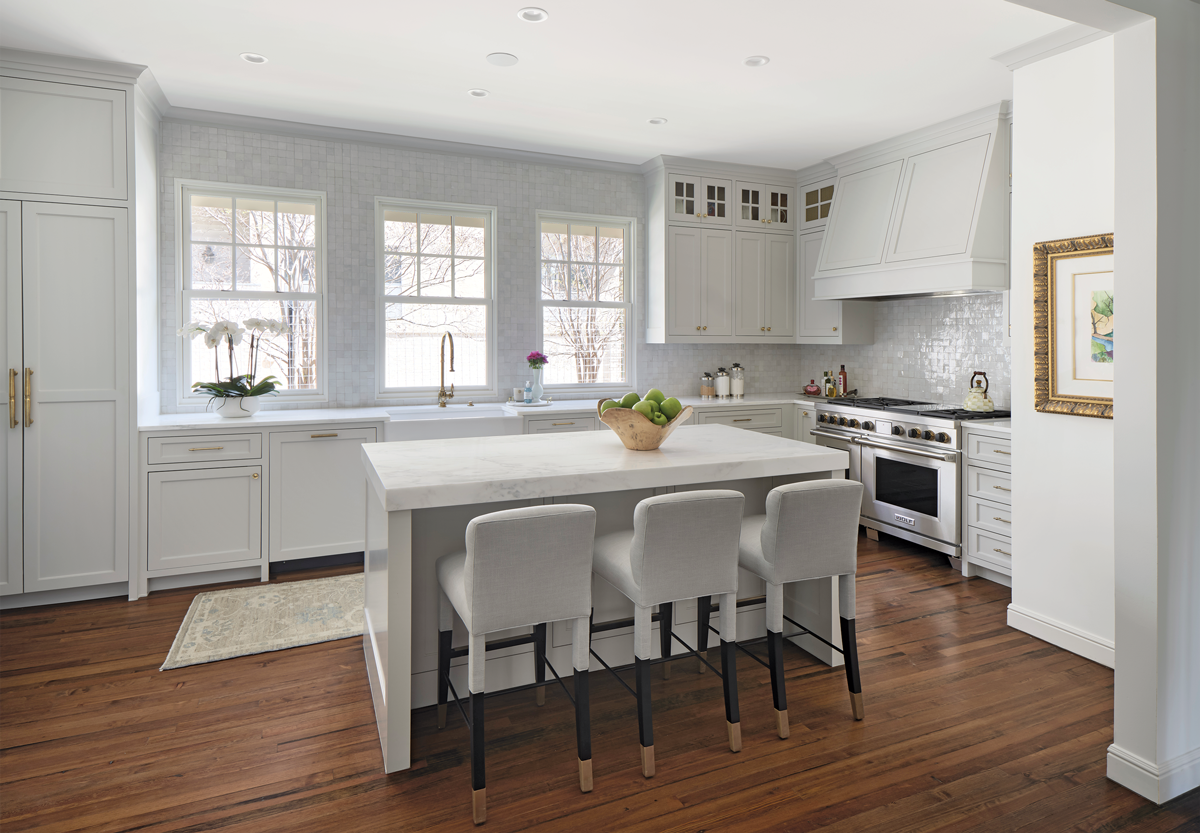 view of the kitchen island, stove, and sink