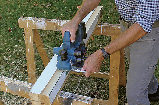 Closeup view of a planer making a rabbet cut