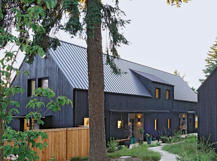 Complete panelized house with dark siding