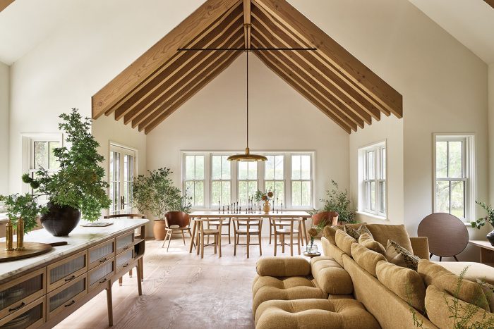 Photo fo a timber frame vaulted ceiling with white walls.