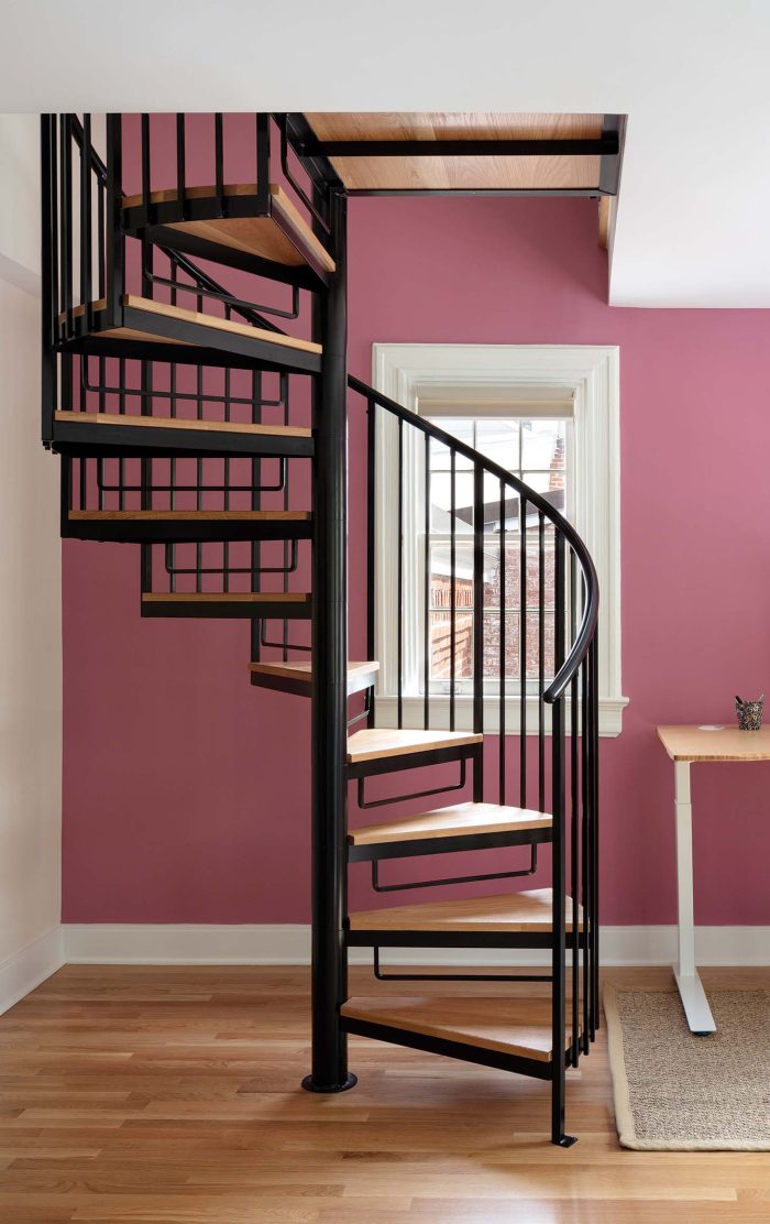 Photo of a metal and wood spiral staircase.