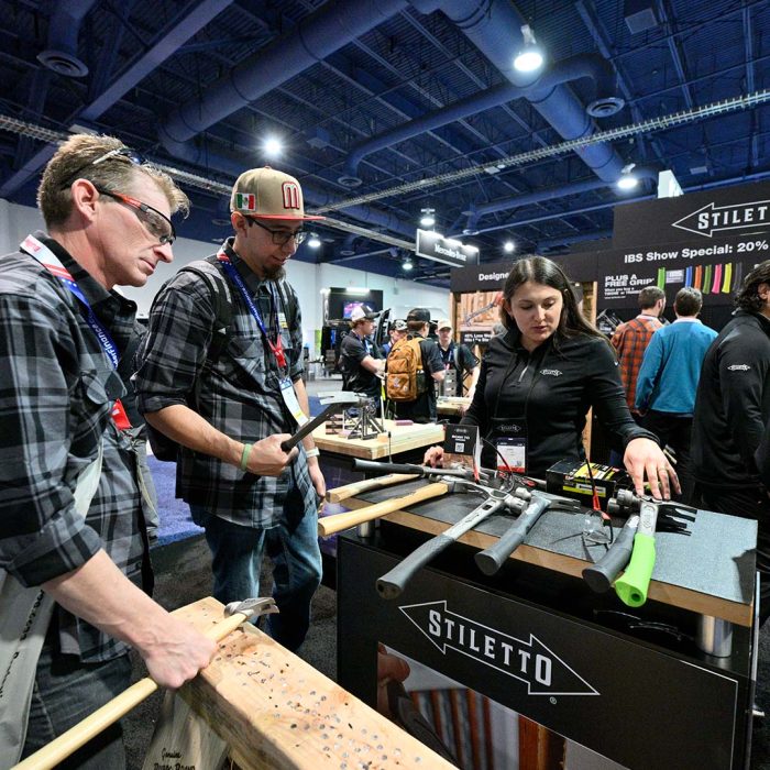 Photo of two men looking at tools from Stiletto at the International Builders' Show.